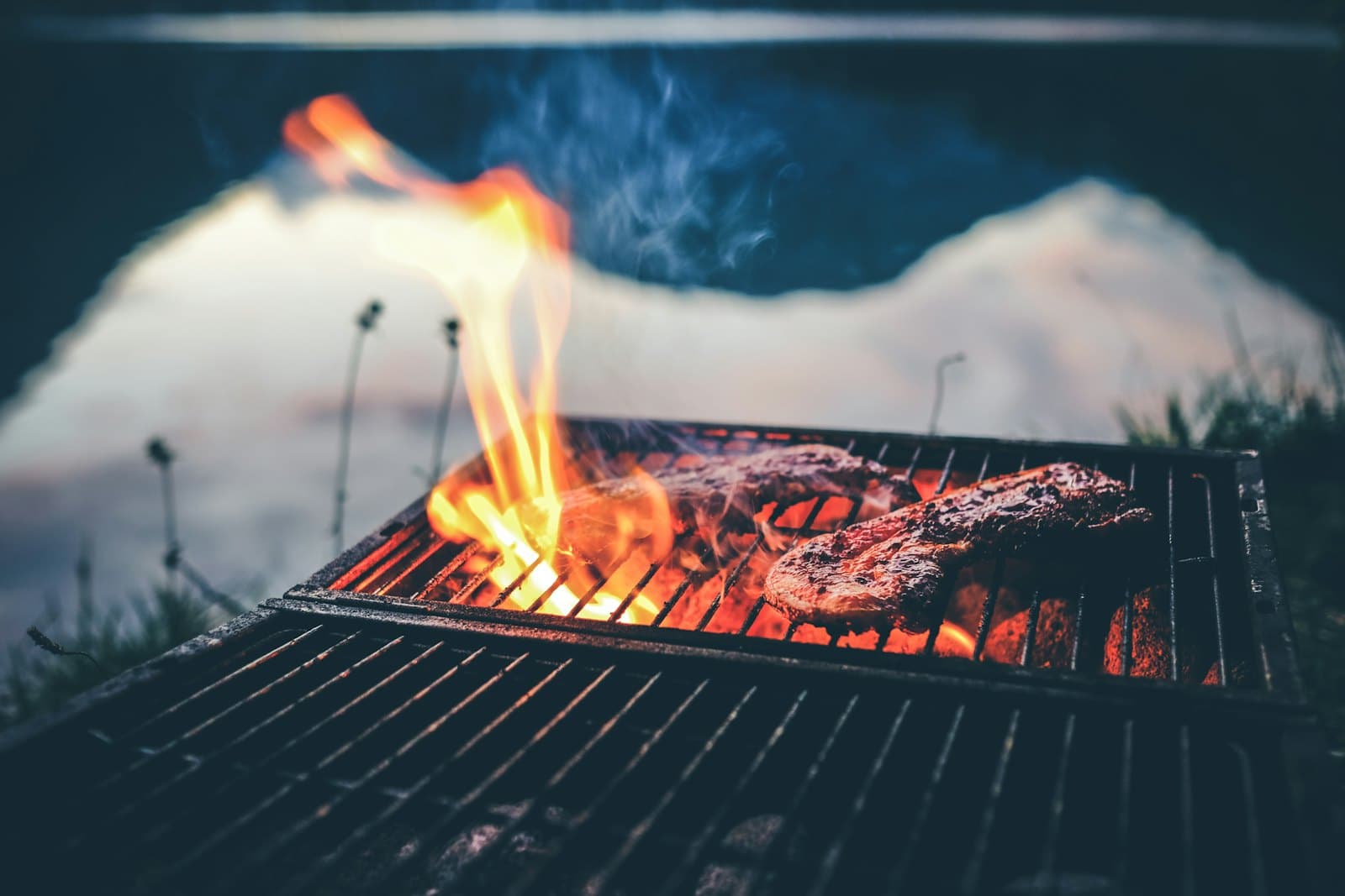 Steak searing over open flames